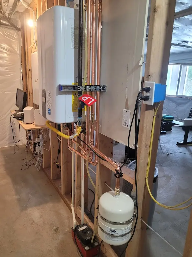 Licensed plumber repairing a kitchen sink in Franklin